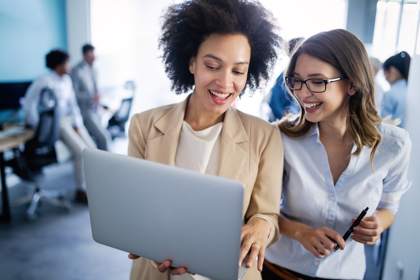 Programmers cooperating at modern IT company developing apps