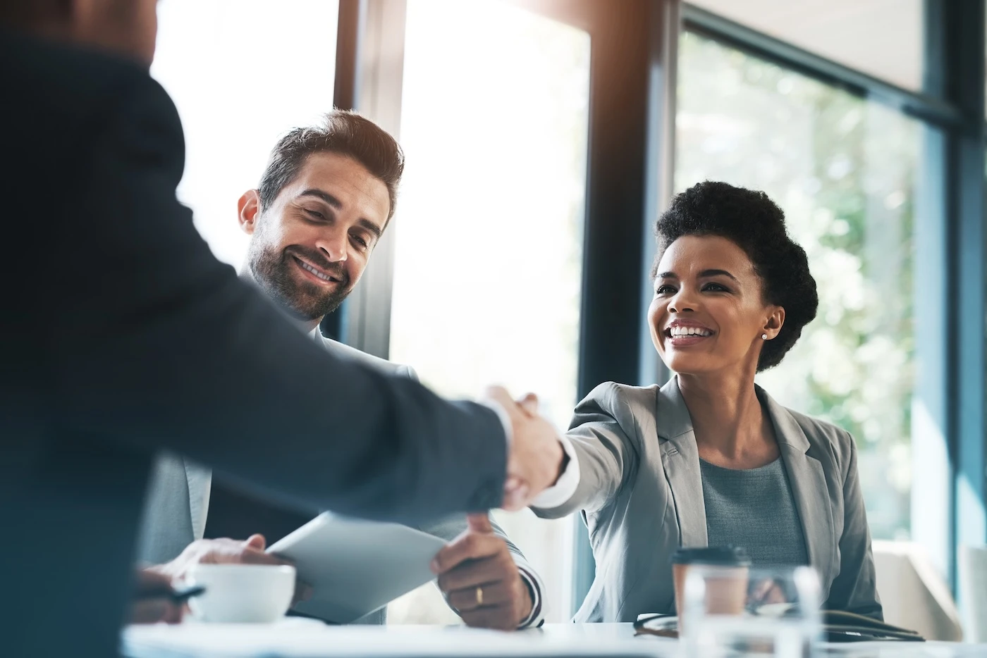 Business people, handshake and meeting for partnership, teamwork or collaboration in boardroom at office. Happy woman shaking hands in team recruiting, introduction or b2b agreement at the workplace. SSUCv3H4sIAAAAAAAAA21Sy26EMAz8l5z3AGyh2/2VqqpMYpaoSYwSsy2t9t/rJEh93mYcezxj+FAjJKvV+UNZ59bEEdhSUOfmoCIGg7HAazwOTUFoLFO04AobgfUcwKM6qzQT8fOpbZu7e3U7qMTAa8Ik2sI0MF5ksPCvpVKWUSXd65iBdDb/1m/Zj0Mogo9qGLrpvtF6QukZTw12CPjQC5n6vh9OMMjL00G9vDJGv3uA1ViqcIlW23CphHjOOYtNOQH57CDNK8usUP2SeQ0eiJG3RfK24m3S4iesfszjqj0O/V3XdMVsbkw1gpHoe5hyktmKaNzqwqJvze5wXRyB4WxSgaER9/V52Q8/UjARwSe2vpoBB34rCDdEX5CnxMtMTKnQDTZvdaRCFgqmL0iTozWO9FbrEPI5vOSFugcXSva7zmgvxUYpVQlnF4Pg8h2yhn1j2B3k30k+nMfAdVpD+DWd/pbeiQJUMWNTInetKdvuGCdBt9sn+M0BfLoCAAA=